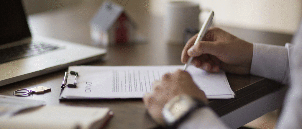 Closeup of businessman filling out paperwork